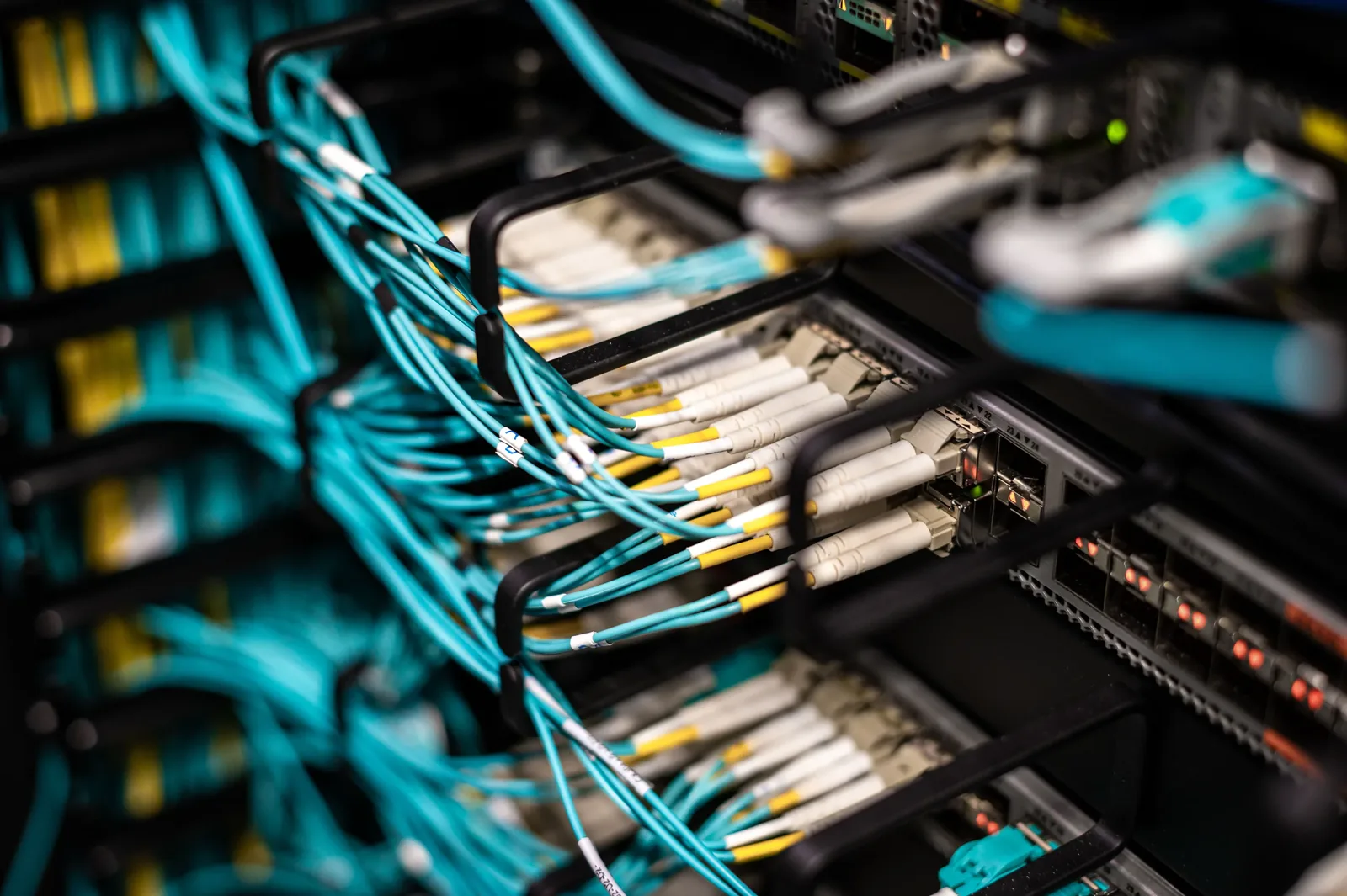 Technician working on physical network cabling